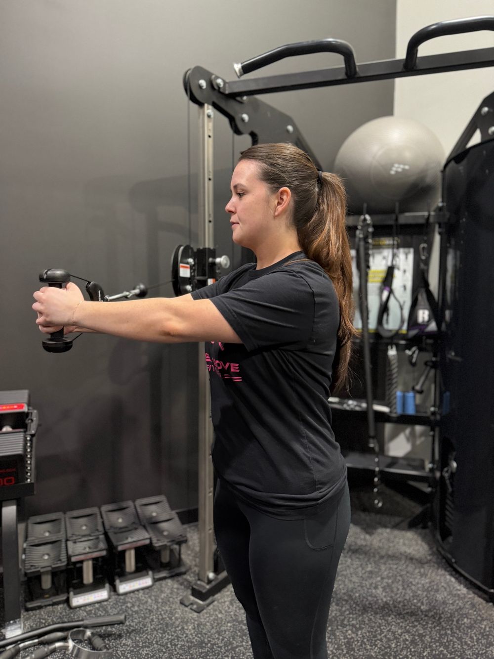 Client doing a cable press in the private training studio